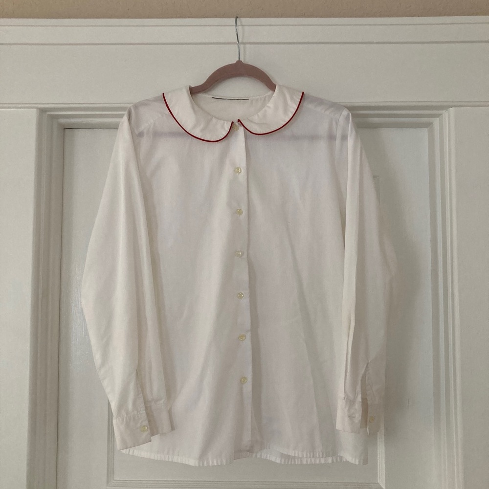 Button up shirt with red lined collar